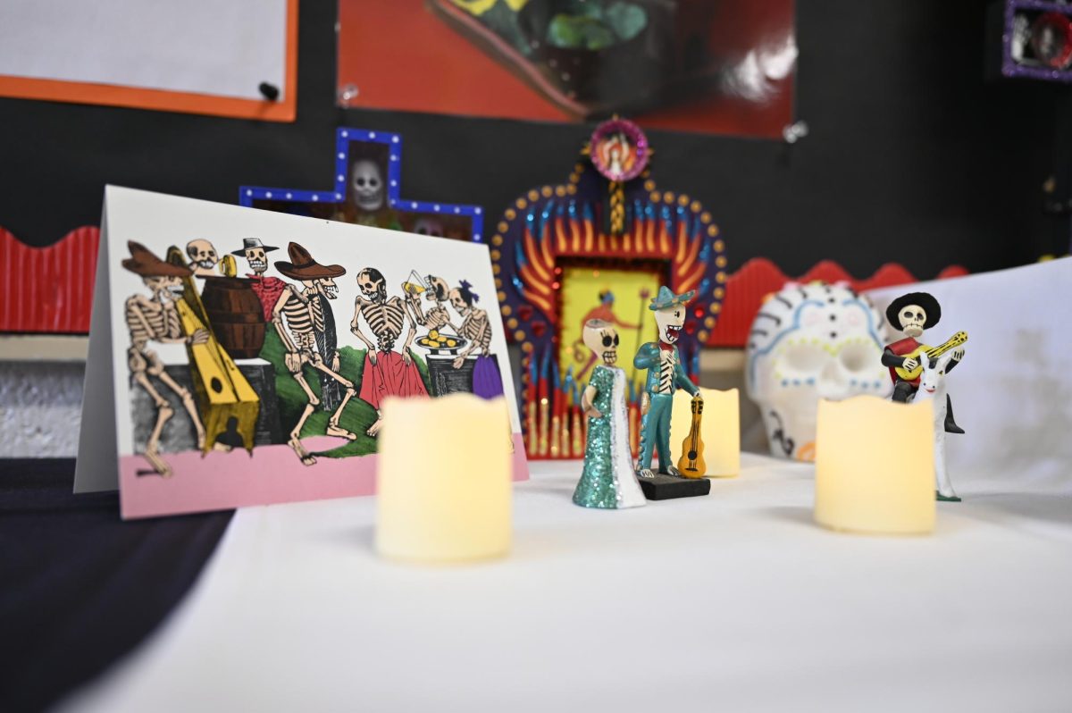 Spanish teacher Diana Moss sets up altars in Main Hall each year for Dia de los Muertos. “On the altar we have a good number of teachers, including Mr. and Mrs. Nichols and a couple of our English teachers,” Moss said.