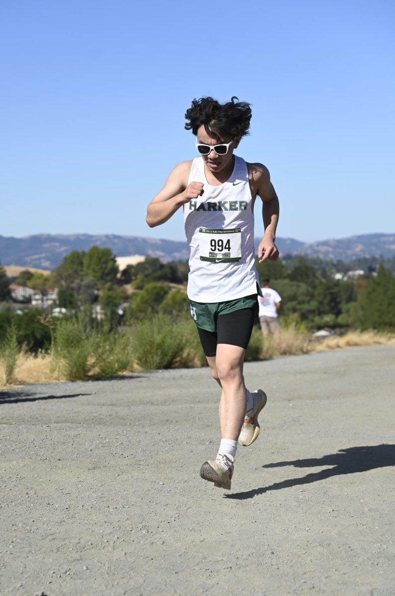 Boys varsity cross country runner Gabe Li (12) passes the one-mile mark at the De La Salle Invitational. For the first time in fourteen years, both boys and girls varsity cross country teams qualified for the CCS championships.