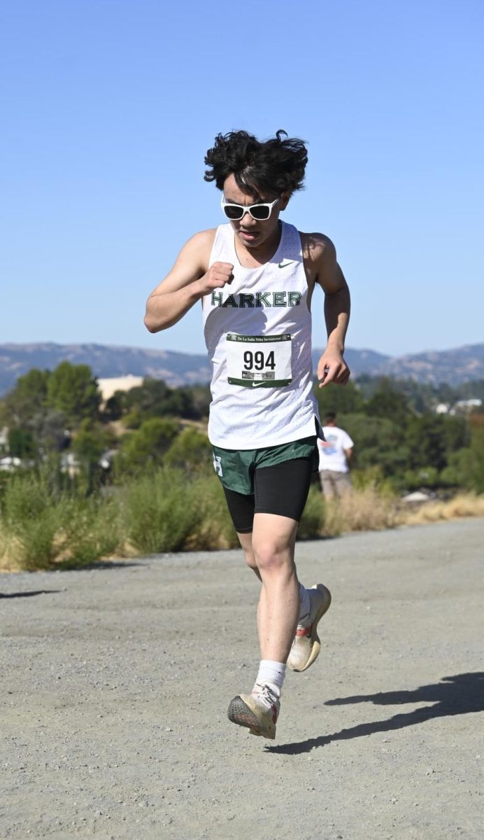 Boys varsity cross country runner Gabe Li (12) passes the one-mile mark at the De La Salle Invitational. For the first time in fourteen years, both boys and girls varsity cross country teams qualified for the CCS championships.