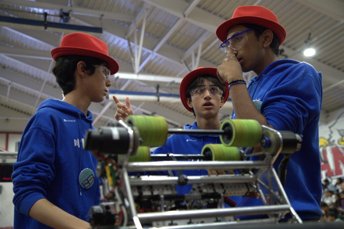 Harker Robotics members Mikhil Kiran (11), Arturo Vilalta (11) and Ayden Grover (10) plan their strategy before sending their robot on the field. The team reached the finals at this year’s Capital City Classic alongside alliance partners Eagle Force, Duncan Dynamics and Robodores.