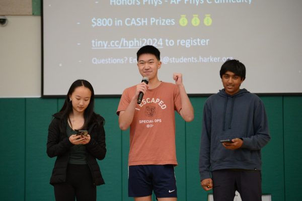 Kallie Wang (11), Neel Kumar (10) and Pascal Qin (10) announce the upcoming Harker Physics Invitational. Winners can receive up to $1000 in cash.