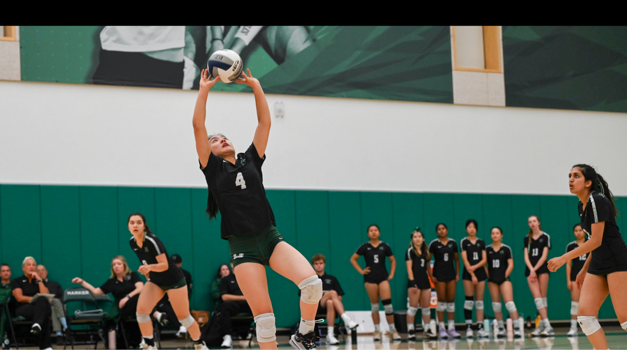 Junior setter Keira Chang sets the volleyball. In the second set, Keira also had a nine-point serving run. 