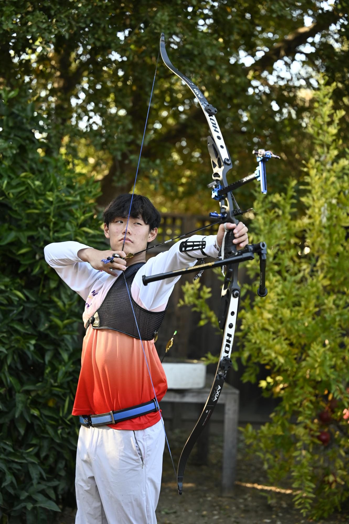 Hanz draws  back an arrow, preparing to fire. "Archery changed from something really simplistic to a place where I can relax and look forward to a new day,” Hanz said.