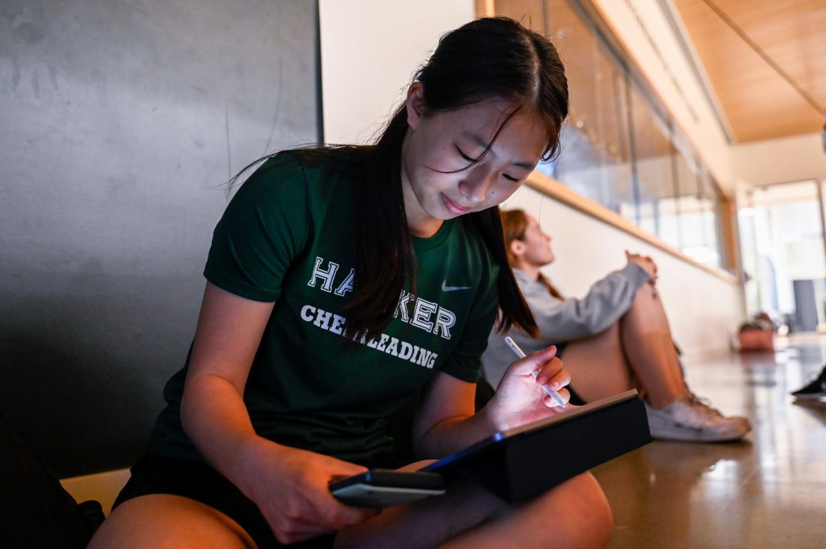 Christy works on her math homework before her cheer practice. In addition to figure skating, Christy is also part of the varsity cheer team, performing at football and basketball games.