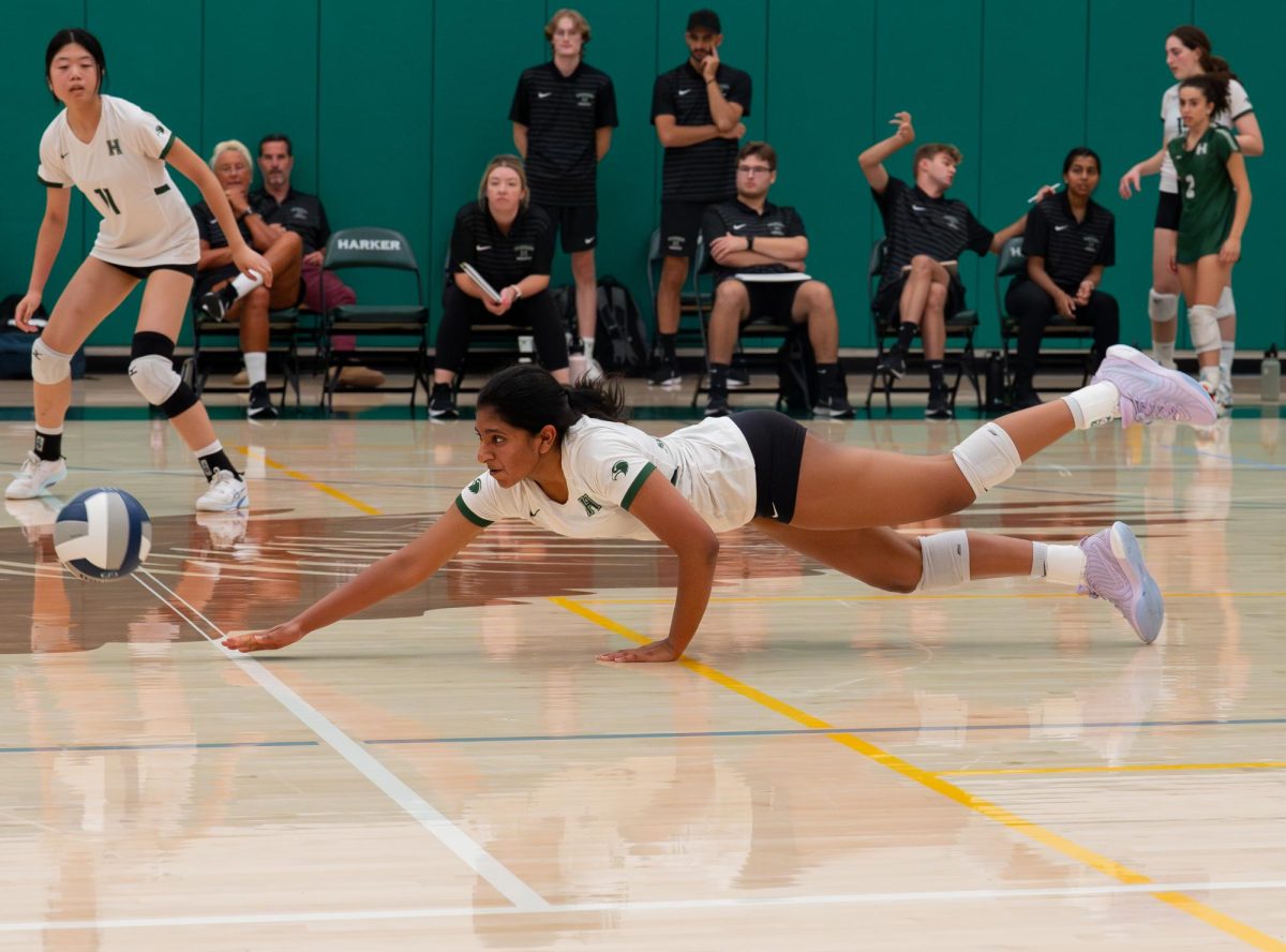 Varsity girls volleyball outside hitter Divya Bhupathi (10) dives to the ground to save a ball. Finishing with an 18-9 overall record, the team's season ended at the first round of CCS.