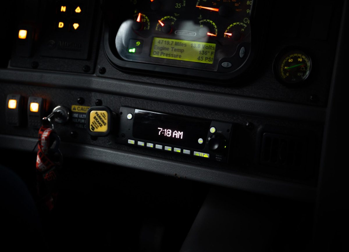 Bus driver Charlene Figone's dashboard displays the time as the bus rumbles to life. Waking up well before the sun rises, Figone was at the upper school before 7 a.m.