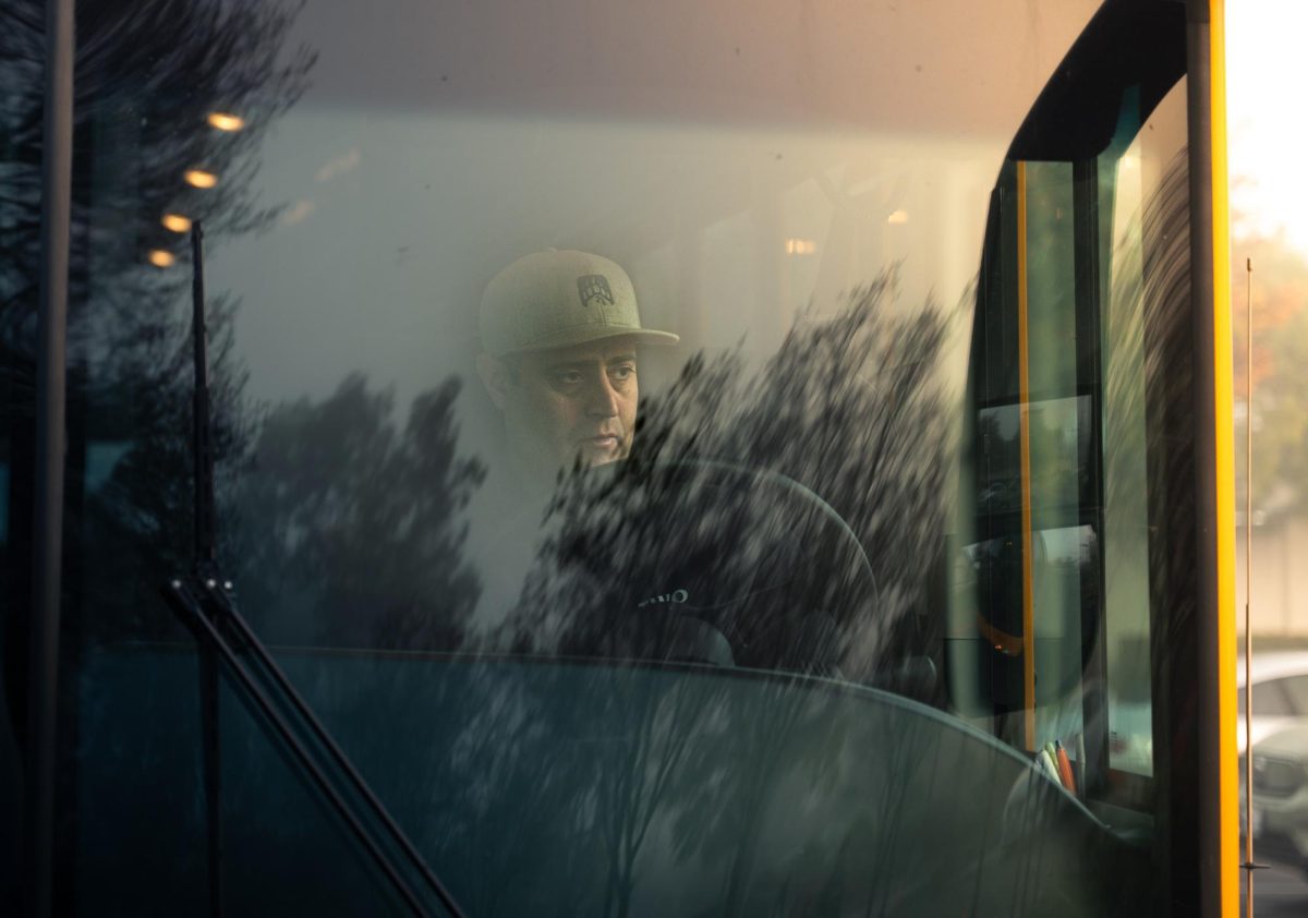 After unloading his students, bus driver Steveo Corsello takes a moment to breathe. The sunlight was barely beginning to break through the fog.