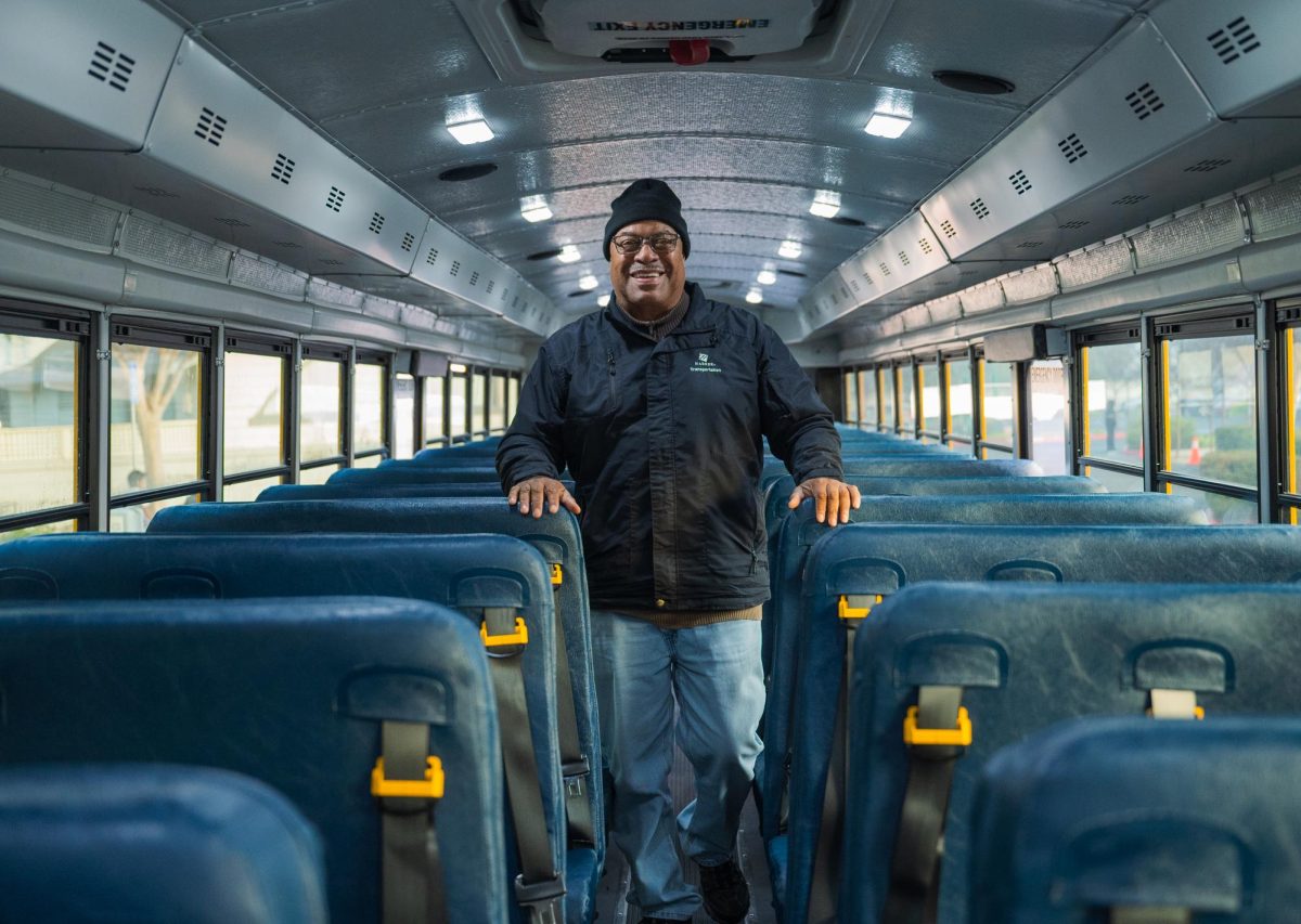 Lead bus driver Ray Frank walks back up the aisle after checking if any students left their belongings. Anywhere from one to two dozen children ride each bus.