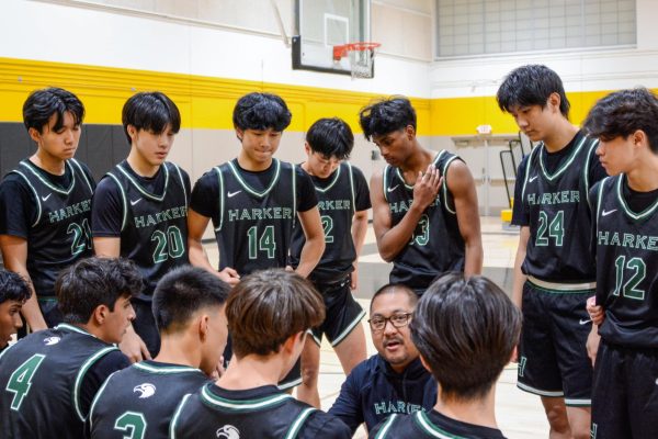 Head Coach Alfredo Alves discusses defensive adjustments during a timeout in the second quarter. “We’ve made tweaks on defense, and tonight will be the first game to see how the team does with them," Alves said. 