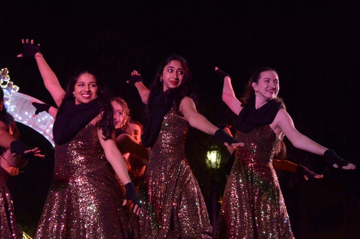 Saanvi Bhargava (12), Shruti Srinivasan (12) and Holly Templeton (11) pose during "Jingle Bell Rock." "It’s so fun to perform because we have such an interactive audience," Shruti said.