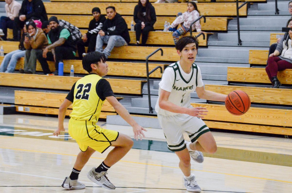 Forward Tyler Wang (10) dribbles the ball during the junior varsity boys basketball game against Andrew Hill. The Eagles managed to hold off their opponents' comeback and secured the win. 