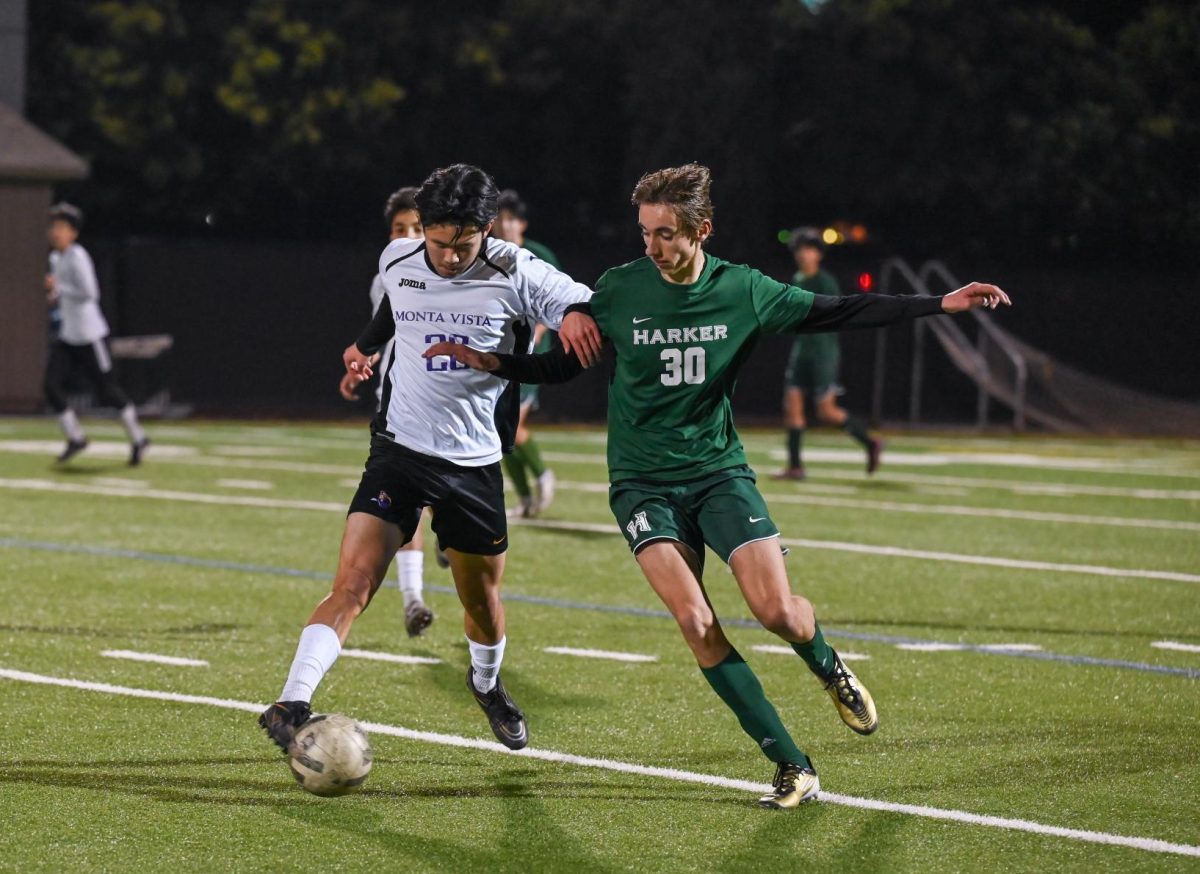 Forward Vouk Praun-Petrovic (11) attempts to steal the ball from an opponent. The varsity boys soccer team ultimately succumbed to Monta Vista 2-5 on Dec. 11. 