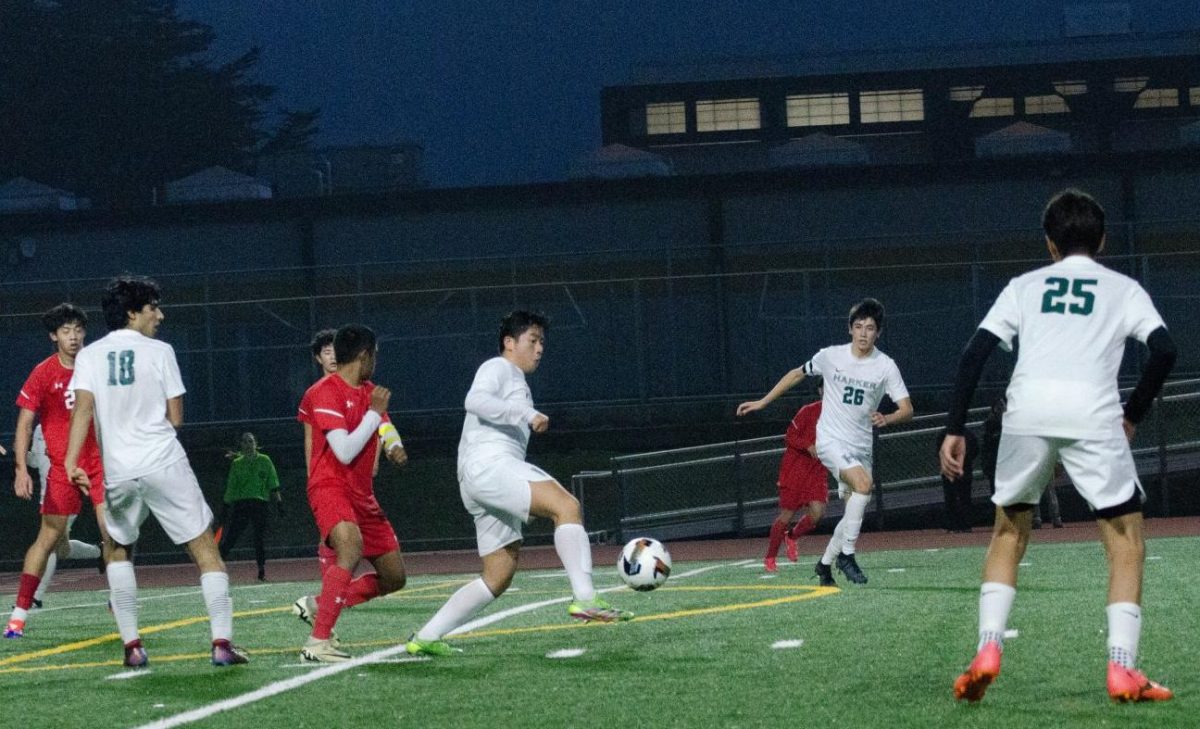 Center midfielder Sam Li (10) controls the ball, preparing to pass to his teammate during the varsity boys soccer game against Mills High School. The Eagles tied with their opponents 3-3. 