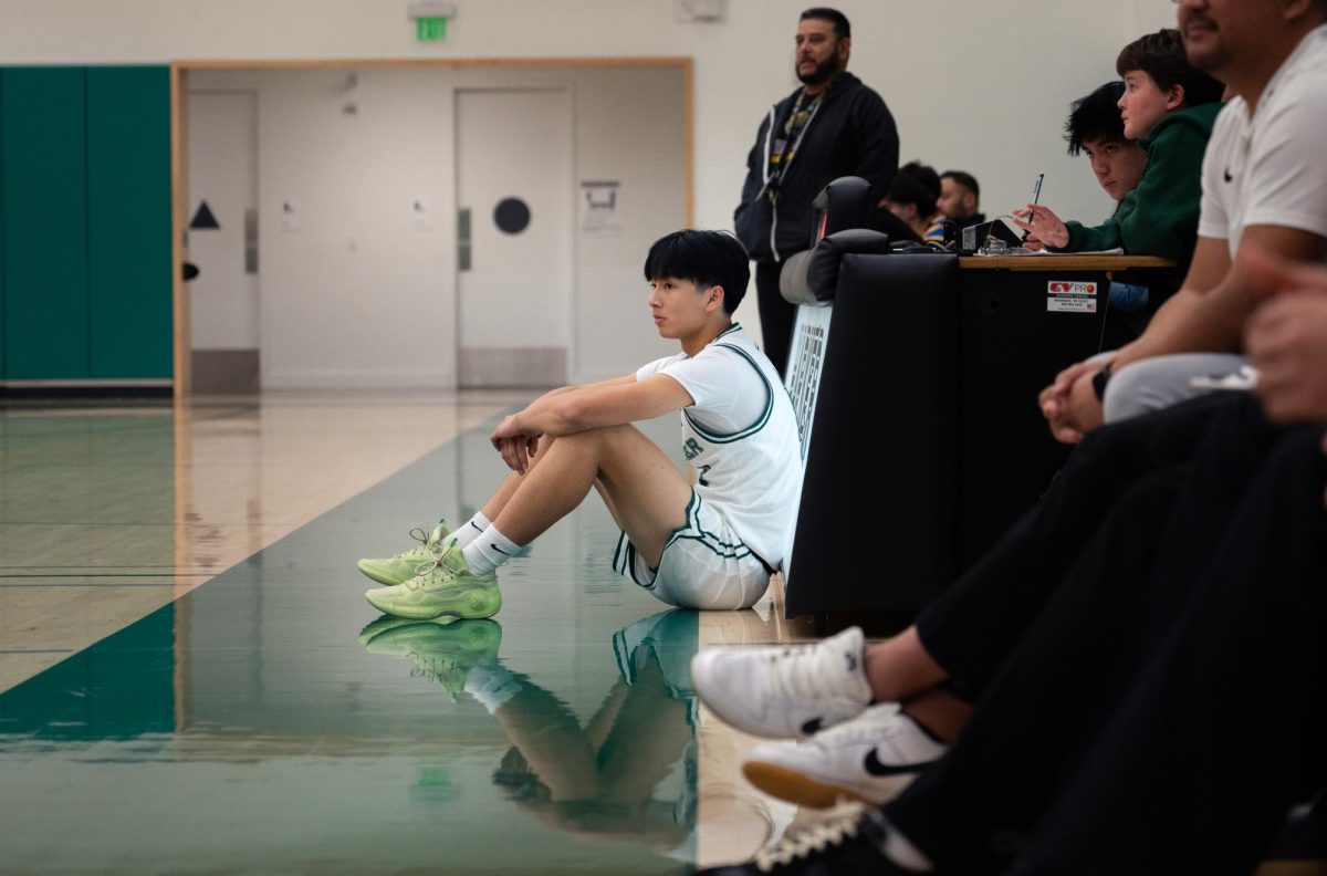 Guard Lucas Huang (9) prepares to be subbed in. Lucas frequently came off the bench in rotation with the team’s older guards, ensuring that the team could keep up their offensive and defensive intensity throughout the game.