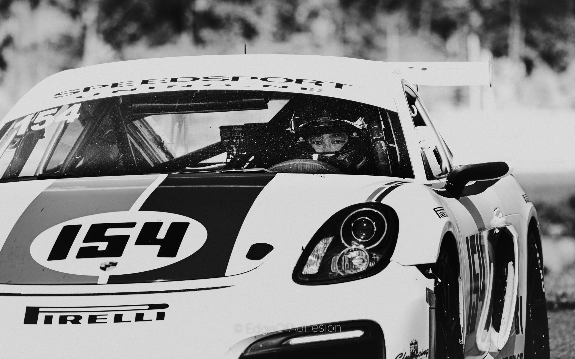 Eric Liu ('06) looks ahead in the driver seat of his Porsche Cayman race car. Liu attended his first track day after a fellow automobile enthusiast invited him. 