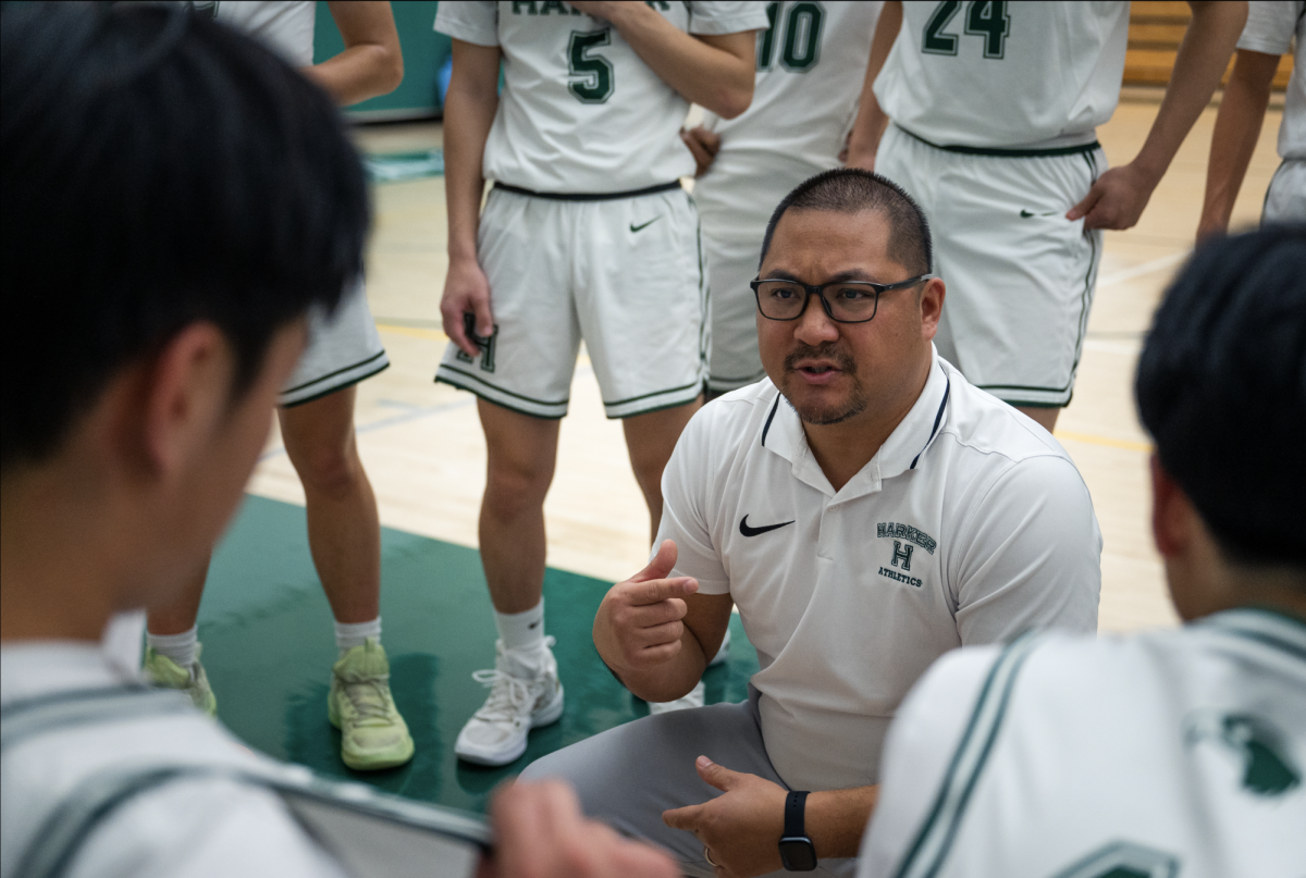 Shooting guard Alan Gao (11) stops his drive short and puts up a floater. Alan contributed 8 points to the Eagles despite returning to the court from a sprained wrist.