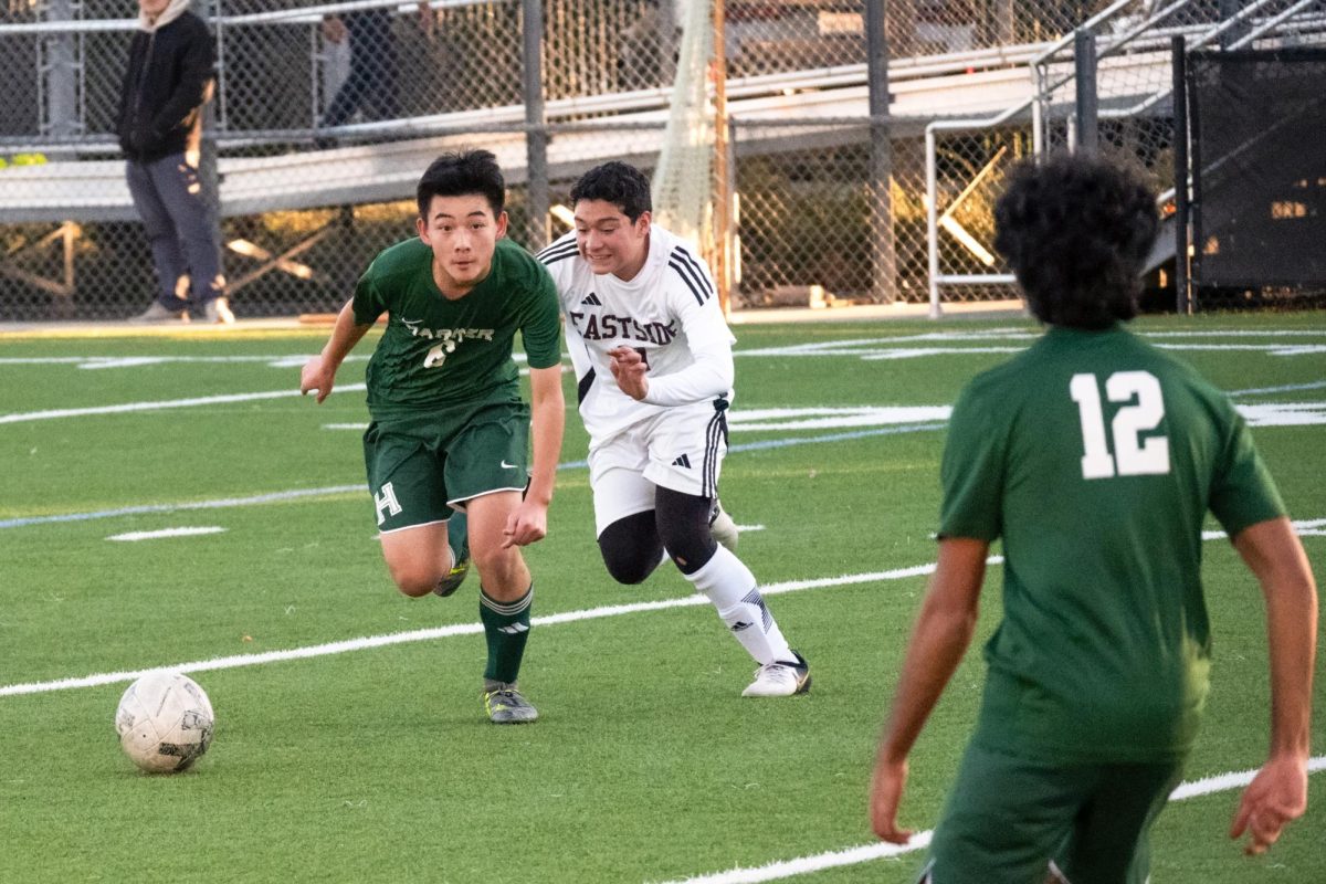 Midfielder and forward Nathan Mao (9) prepares to pass the ball to a teammate on Wednesday. The Eagles maintained steady offensive pressure throughout the game.