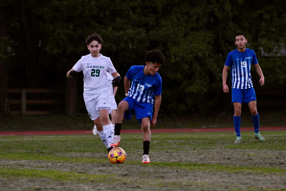 Central midfielder Alexander Maxim (9) races to steal the ball from a Priory player. The Eagles defeated the Panthers 4-3 on Friday.