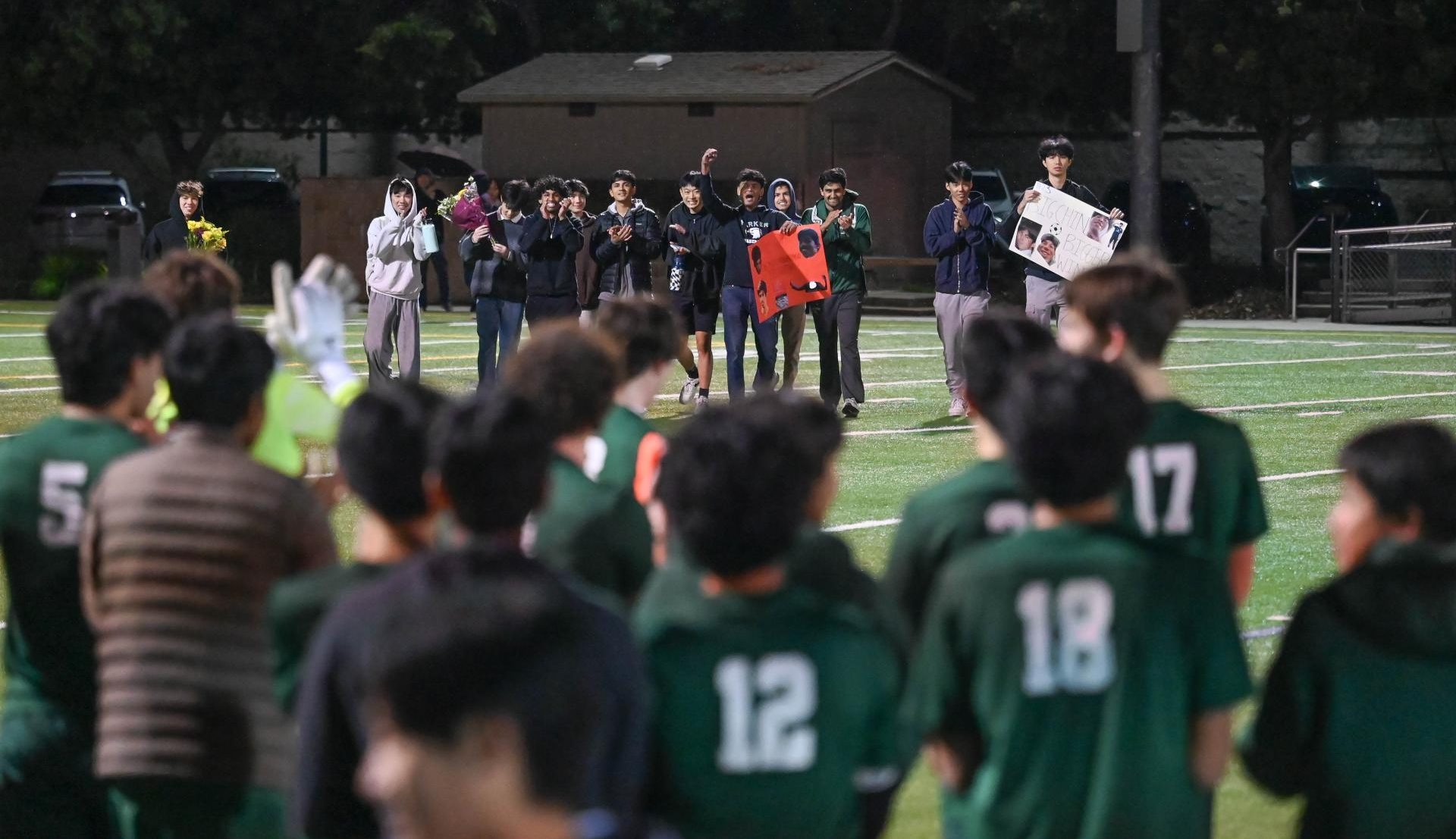 After the match, the seniors' friends rushed onto the field to congratulate them, bearing posters and flowers. Classmates and family members all came out to Davis Field in support of the graduating players on Wednesday night.