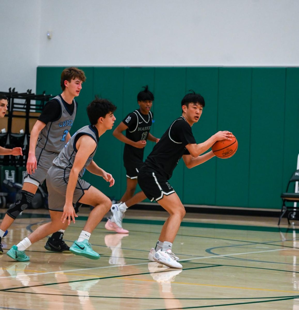 Co-captain and point guard Bowen looks to make a pass. Bowen sunk the last basket of the first quarter. 