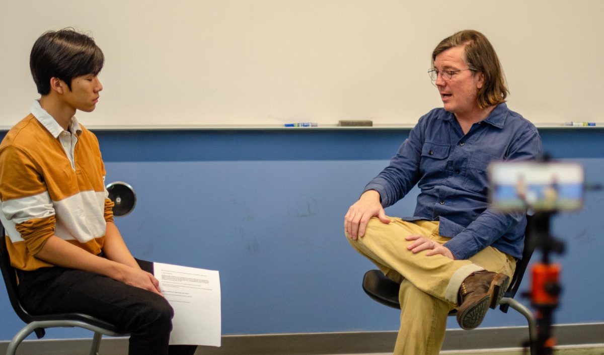 Physics teacher Mark Brada speaks to Astronomy Club president Eric Dong (11) about his experiences as academic and career journey in engineering. Astronomy Club hosted the event as part of the A Space for Space speaker series.