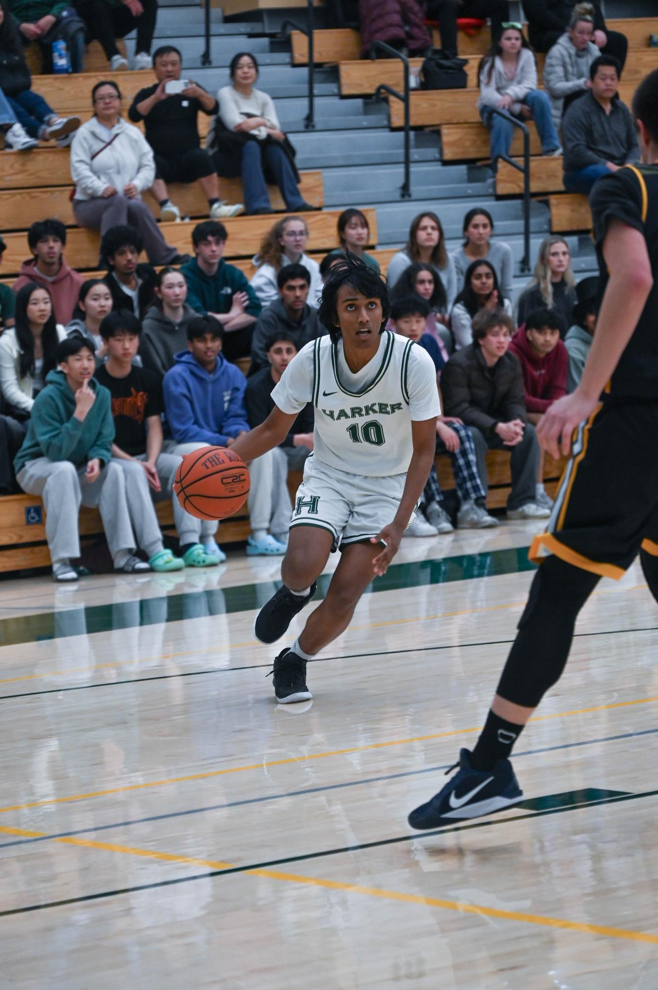 Shooting guard Rishaan Thoppay (11) drives at a Marina defender. Although the Eagles created numerous opportunities throughout the first half, most of their shots bounced off the rim.