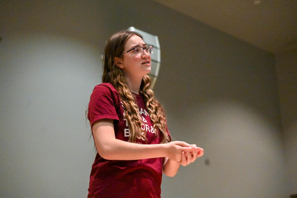 Junior Holly Templeton performs her poem during the Poetry Out Loud contest on Jan. 27. She received an honorable mention from the judges. 