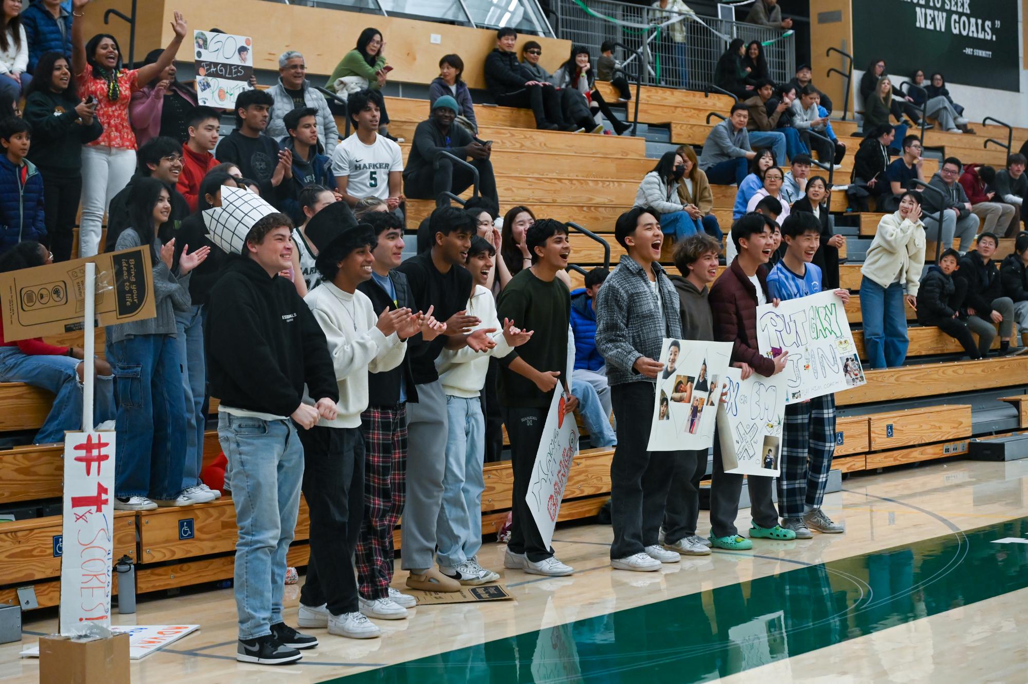 Junior and senior audience members cheer on the Eagles. Students, faculty and parents supported the team from the bleachers. 