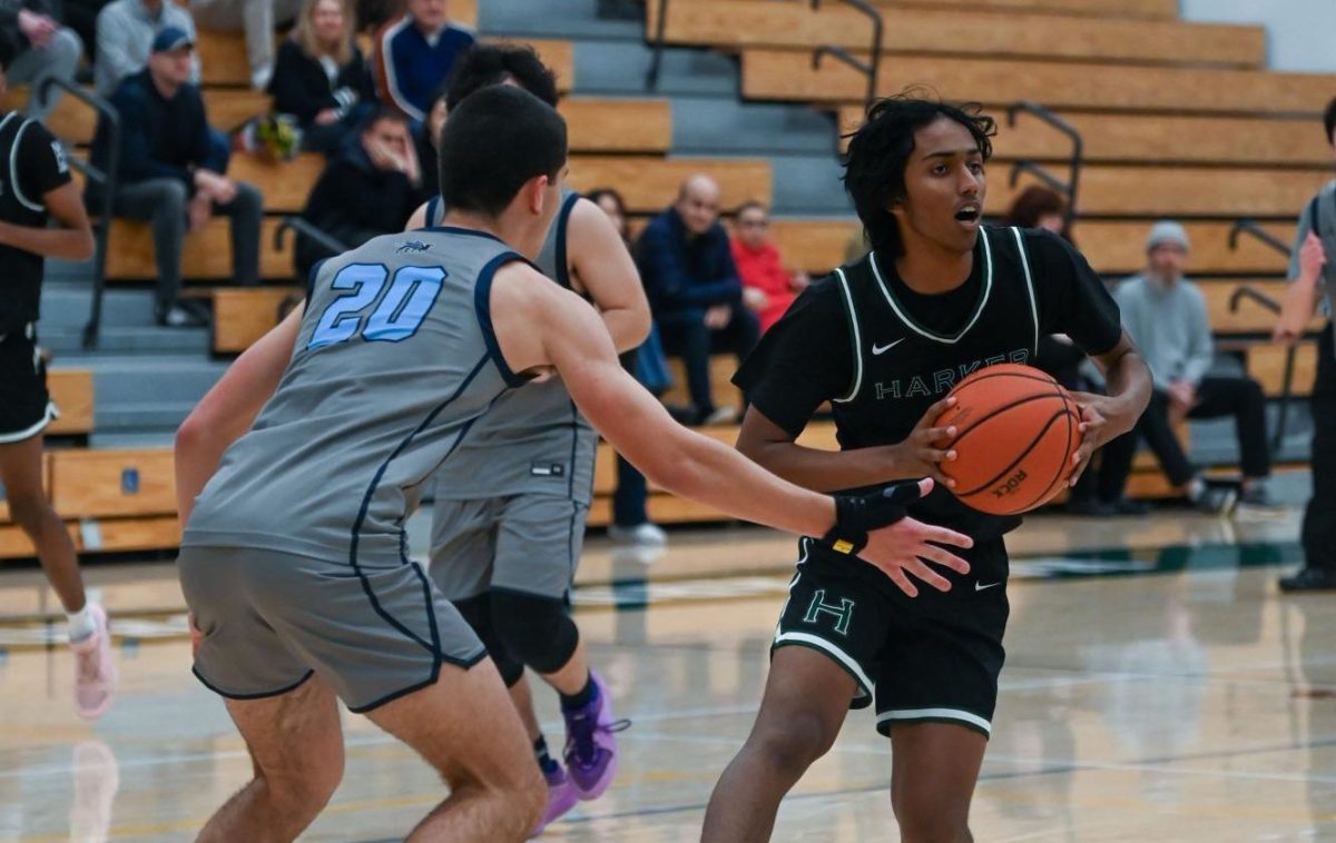 Shooting guard Rishaan Thoppay (11) prepares to make a pass. The Eagles maintained their lead, finishing the fourth quarter 82-67. 