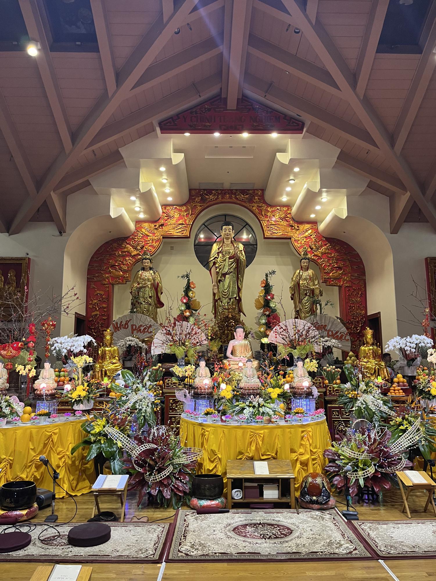 Offerings lie under a Buddhist shrine. People who celebrate Tết typically place offerings for their ancestors.