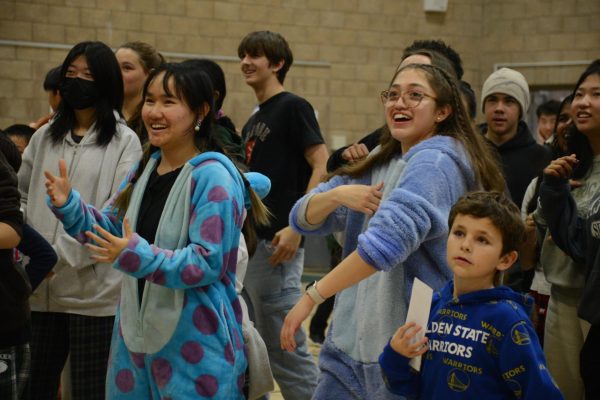 Sophomores Jessica Chen and Brianna Madrigal follow a dance on GoNoodle. This activity ended this pajama-themed Eagle Buddies visit.