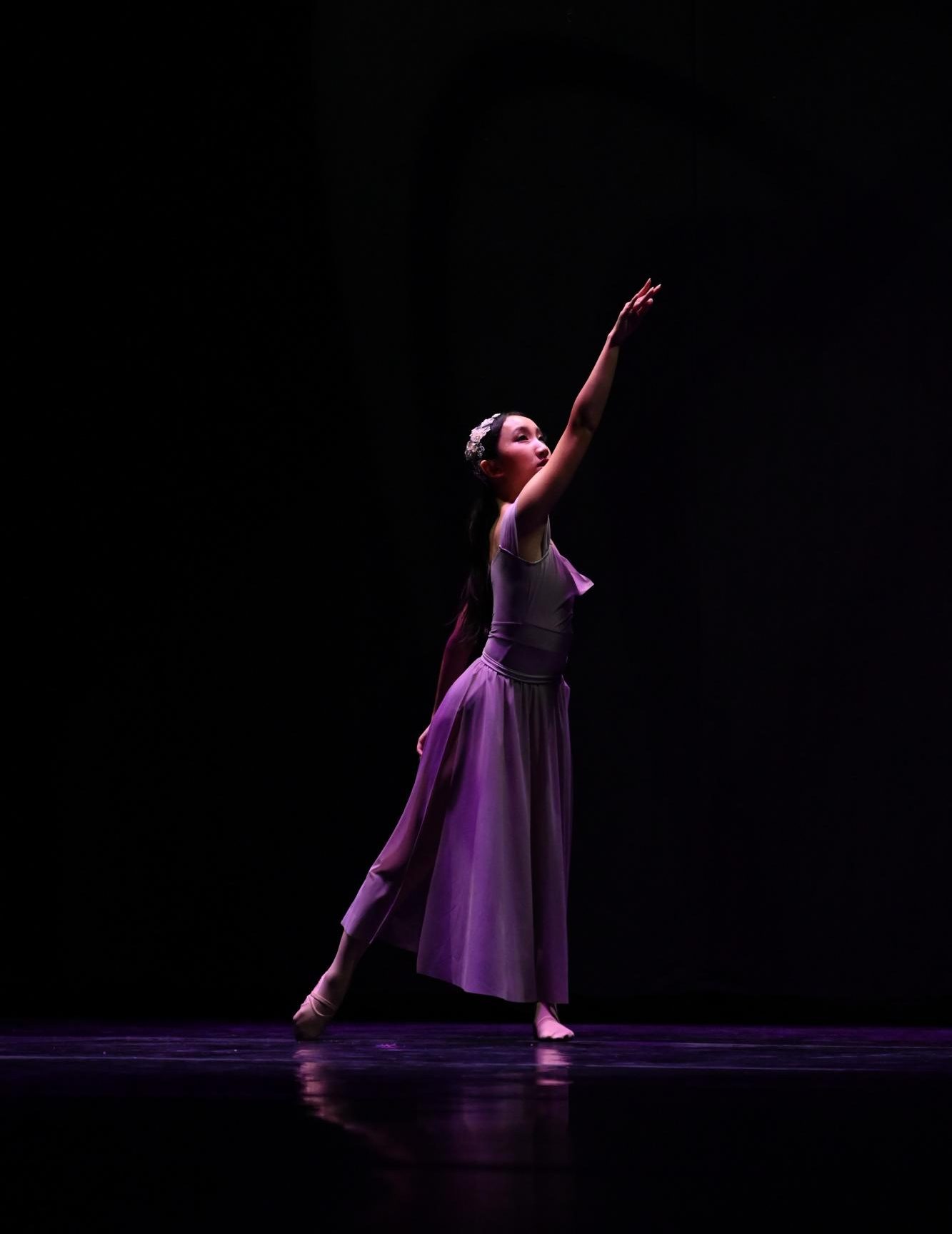 Junior Lily Shi strikes a final pose in "Sweetest Devotion" by Adele. The dance production consisted of twenty dances, including the opening and finale. 