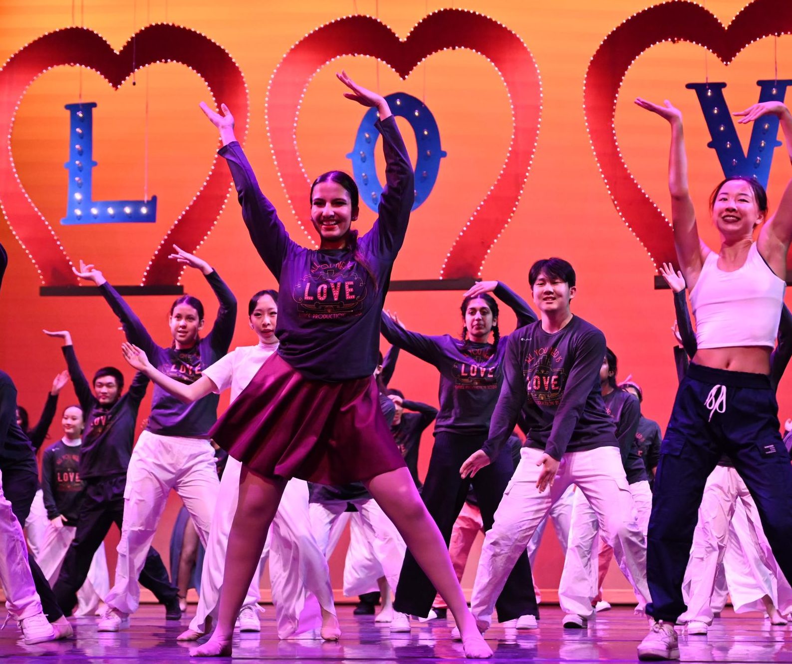 Harker Dance Company captain Yasmin Sudarsanam (12) dances in the show's finale. She has been captain of the team for the past two years and choreographed one dance in this year's "All You Need is Love" show.