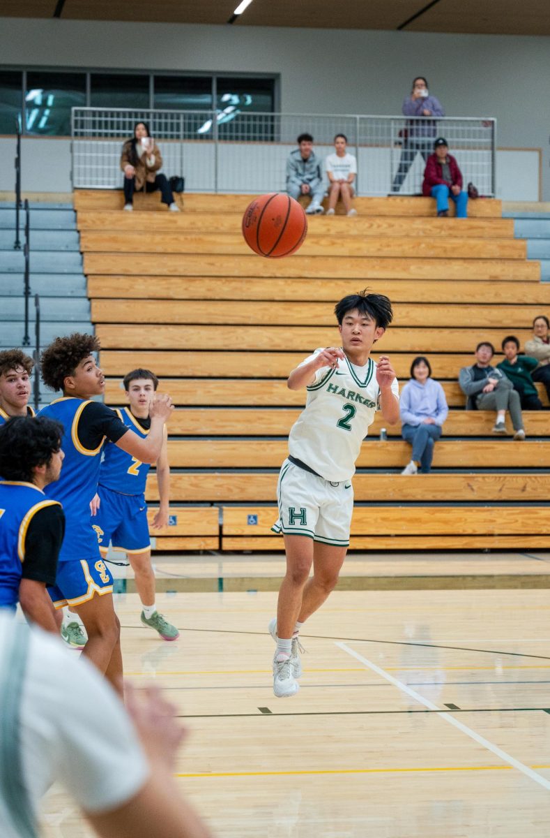 Guard Bowen Xia (12) passes the ball out to Lucas Huang (9) in the corner. By building a 16-point lead in the first quarter, the Eagles stayed ahead of Santa Clara all game, winning 66-52.