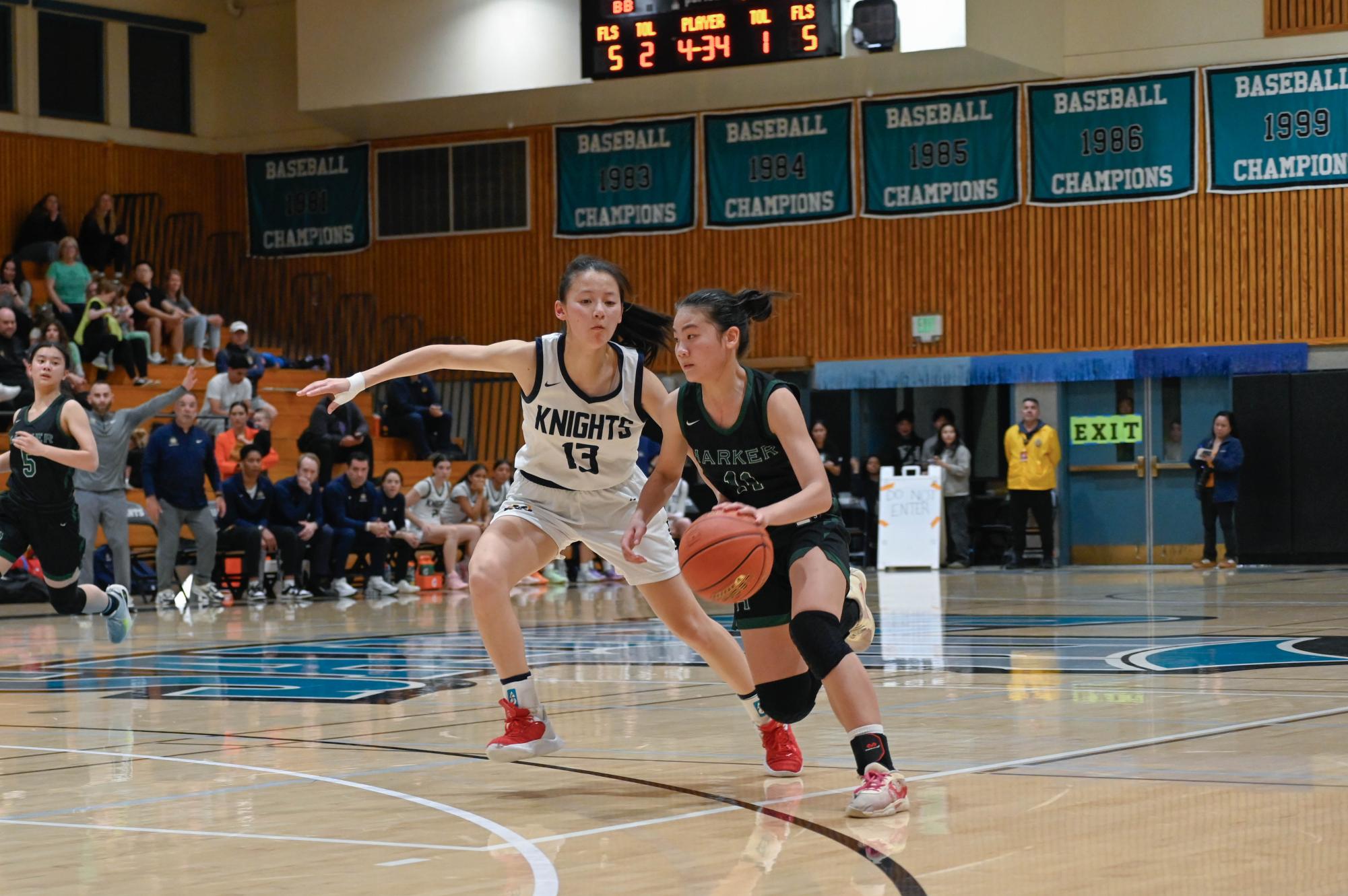 Point guard Jillian Chen (9) drives to the basket to set up a shot. The Eagles' strong offensive start allowed them to jump to an early lead. 