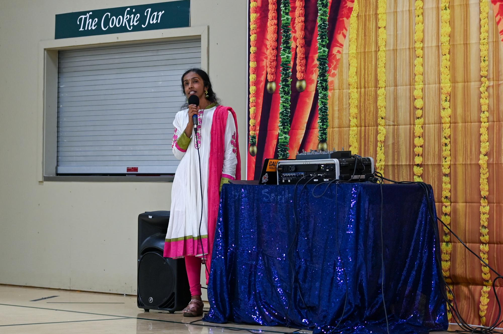 ISA adviser Anu Aiyer sings “Chinna Chinna Asai,” a song highlighting joy in small wishes. She chose the song to wish the graduating class happiness in their future endeavors. 