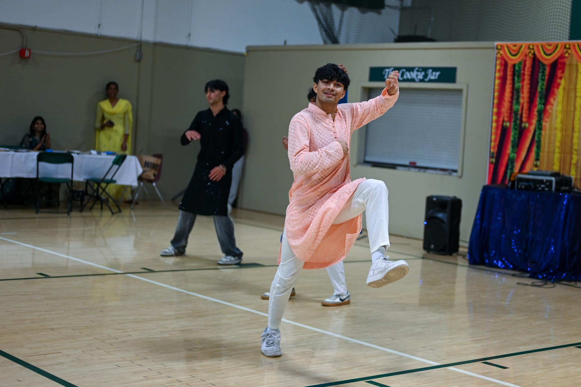 Senior Rushil Jaiswal executes a traditional dance move during the performance of “Badmateez Dil.” Rushil choreographed the number and taught it to ISA members during a club meeting.