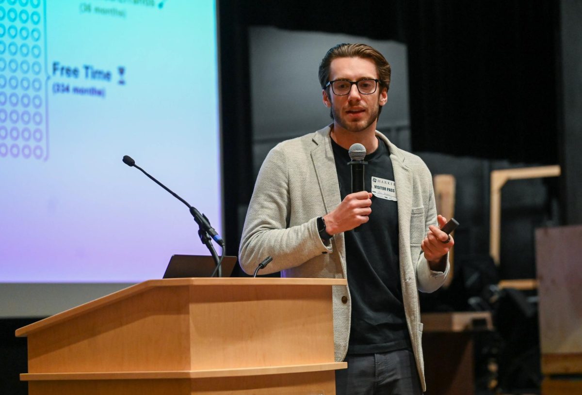 Project Reboot founder Dino Ambrosi talks to students about the negative effects of excessive screen time in a LIFE assembly. To help students limit screen time, Ambrosi suggested several apps like ClearSpace and ScreenZen.