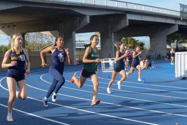 Frosh Emma Wang rounds the curve in the girls 200-meter dash. She competed in the 100 and 200 and also contributed to a top three finish in the girls 4x400 relay.