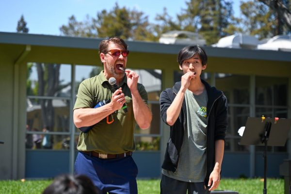 Chemistry teacher Andrew Irvine and Harrison Chen (12) eat a rhino beetle. This year, Irvine invited other students such as 2025-26 ASB President Luke Wu (11) and Green Team officers Summer Adler (12) and Eric Zhang (12) to taste from his selection of bugs.