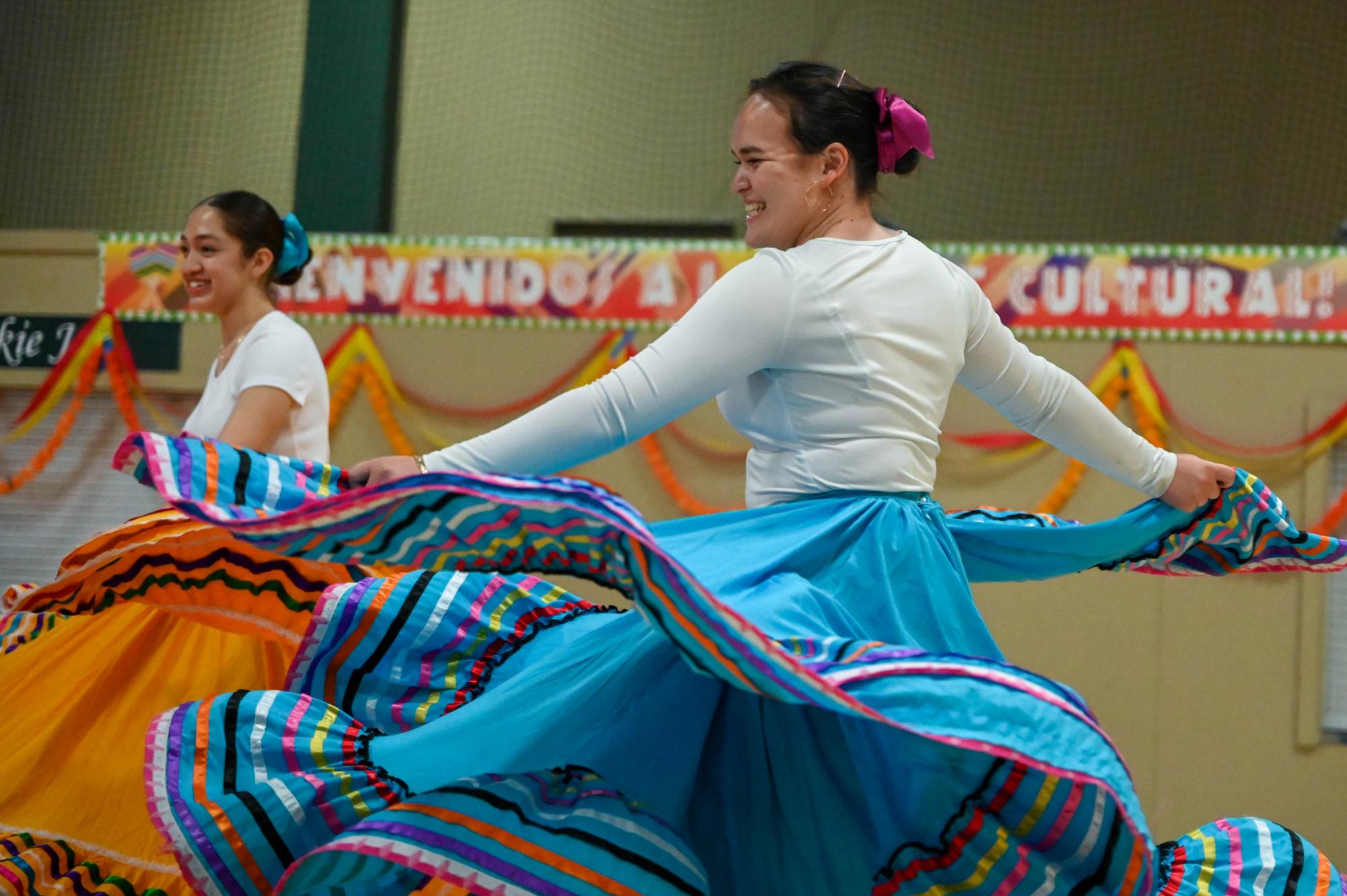 Junior Sofia Vasquez-Perez performs a Spanish folk dance to the song “La Madrugada”. Spanish students volunteered to perform singing and dancing acts, instrumental covers and other acts at Noche Cultural.