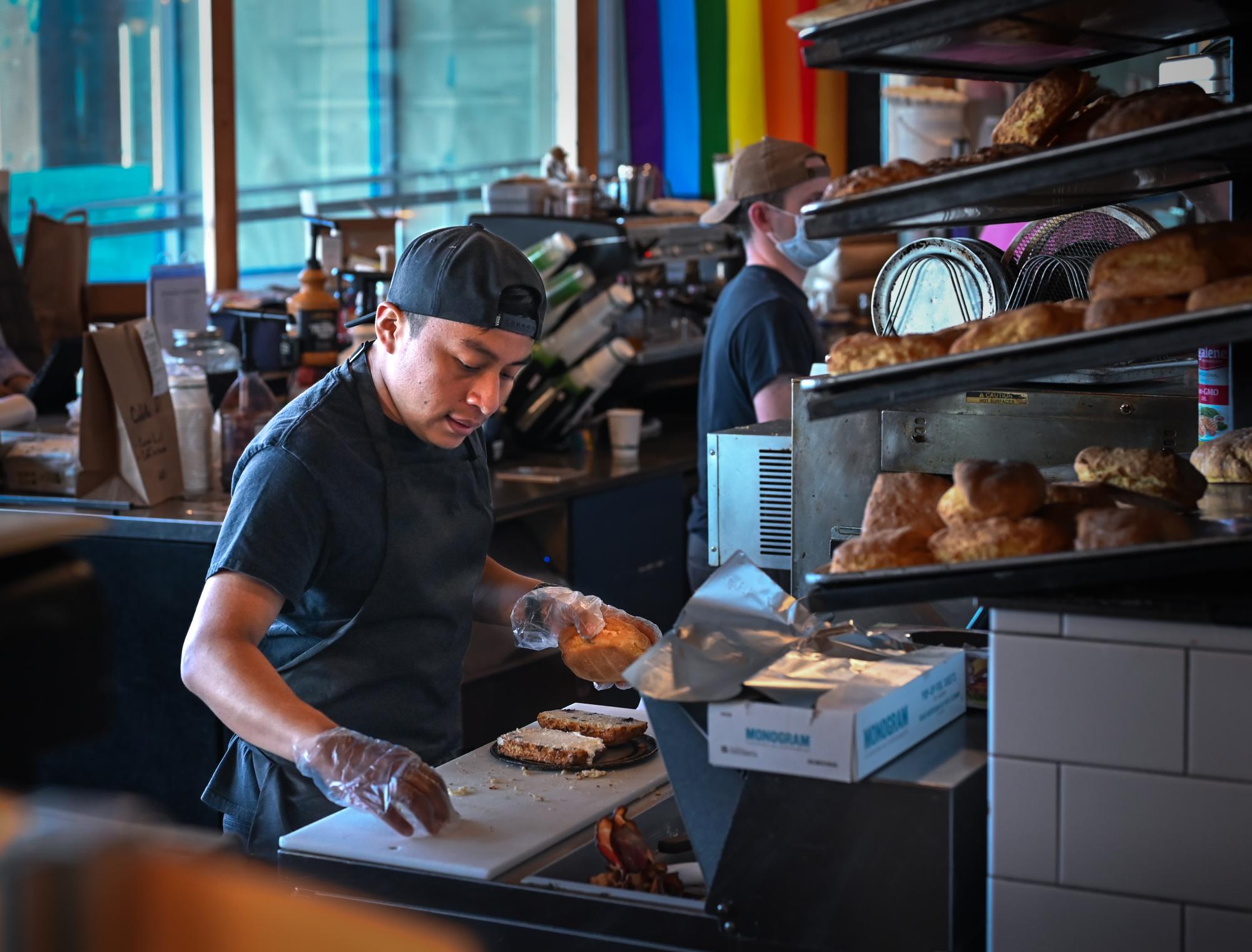 An Honest Biscuits employee builds a sandwich. For those exploring Pike Place Market and seeking a satisfying meal with a touch of homemade comfort, Honest Biscuits delivers.