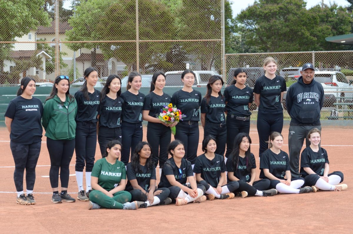 The varsity softball team poses for a group photo during their senior night. Senior Olivia Guo was the only senior on the team this year.