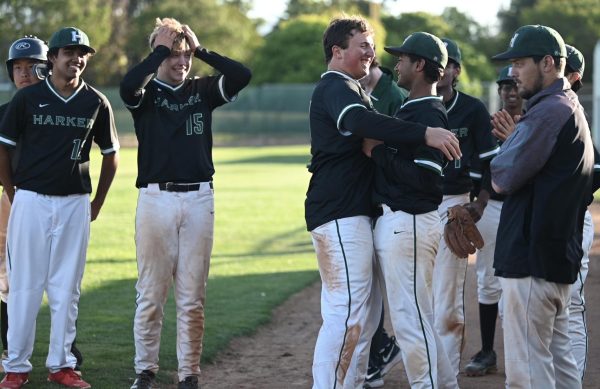 Senior Gabe Sachse and sophomore Shaurya Jain hug after winning the game. “I don’t want to say goodbye because [the seniors] are my friends outside of baseball as well,” Shaurya said. “Either way, I wanted to go all out for the seniors.”