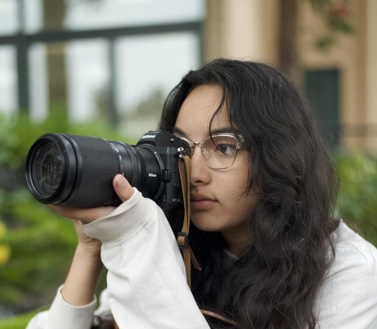 “Photography reshaped the way I see certain things because it helps me see perspectives. There are a lot of different perspectives and a lot of different emotions that people have, so I feel like I can be more attuned to how people feel after looking at a lot of pictures of people's emotions and feelings," Angelina Burrows ('25) said.