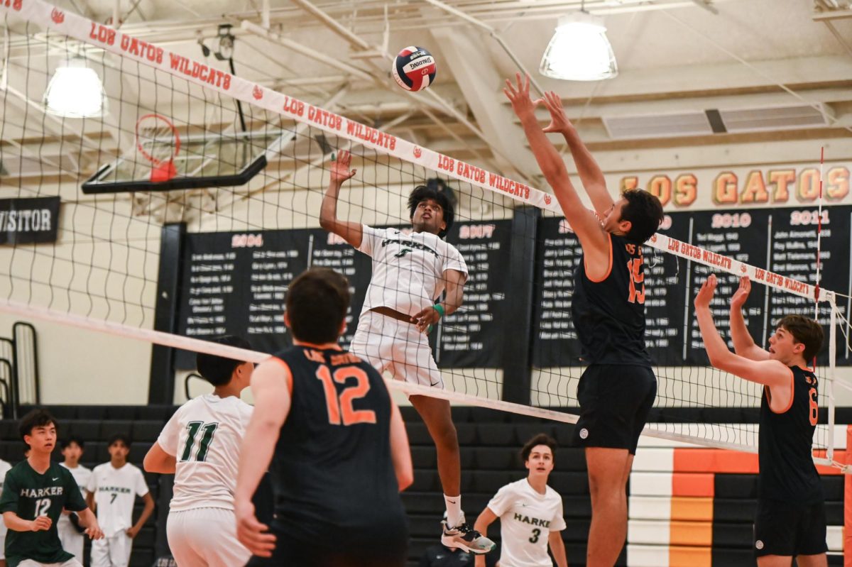 Co-captain Rahul Yalla (12) swings out of the middle. Quick "one" sets were a staple play for the Eagles during the game against Los Gatos.