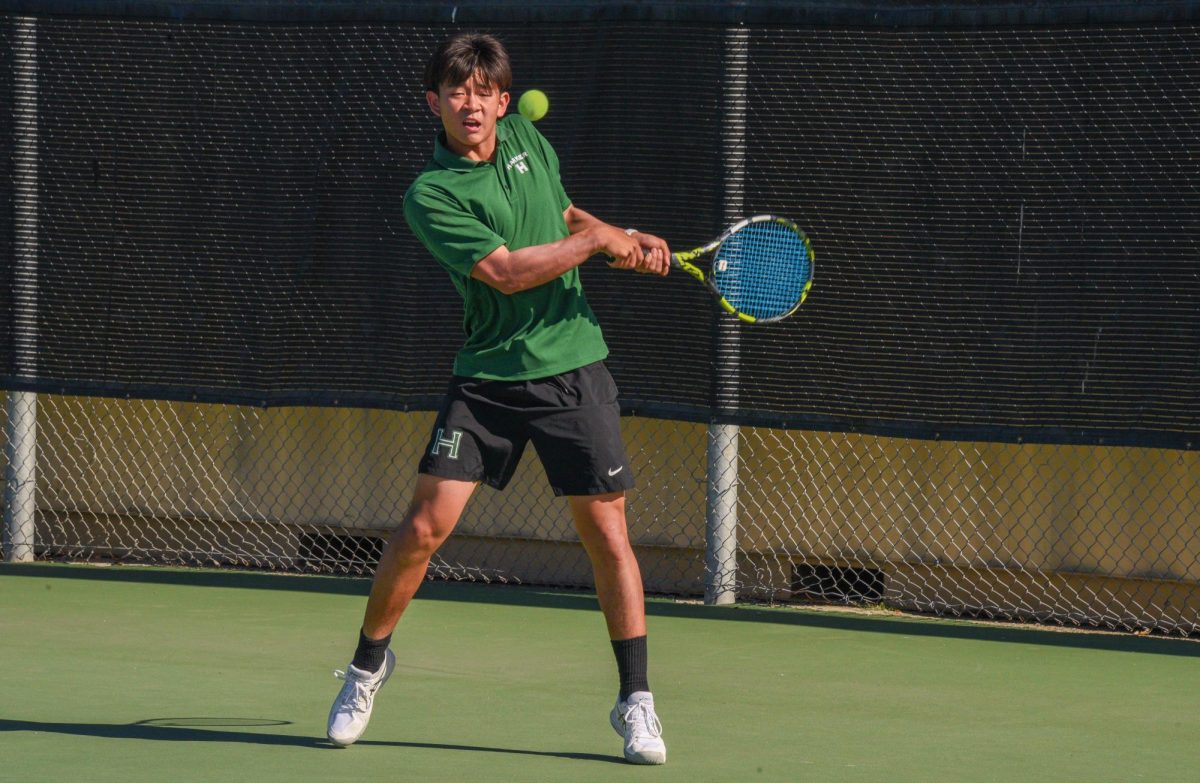 Ryan Miao (10) prepares to return a hit during his singles match. He prevailed in straight sets 7-6(3), 6-1.