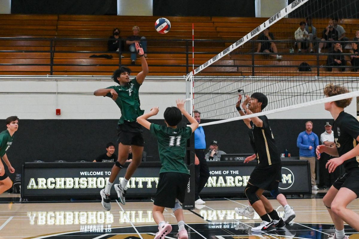 Middle blocker Rahu Yala jumps up for a swing. The Eagles lagged behind Mitty at the beginning of the game but came back to win the set at a close 26-24.