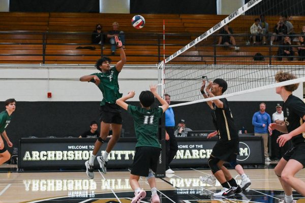 Middle blocker Rahu Yalla jumps up for a swing. The Eagles lagged behind Mitty at the beginning of the game but came back to win the set at a close 26-24.