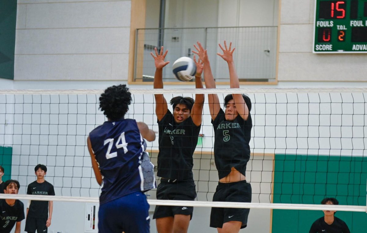 Co-captains Rahul Yalla (12) and Aaron Guo (12) block an incoming ball. Harker eagles beat the Lynbrook vikings in a three-set match on April 30.